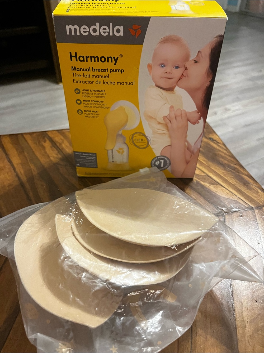 Medela Harmony Yellow and Cream Packaging with Nursing Pads